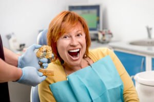 woman after dental implants procedure Placerville CA